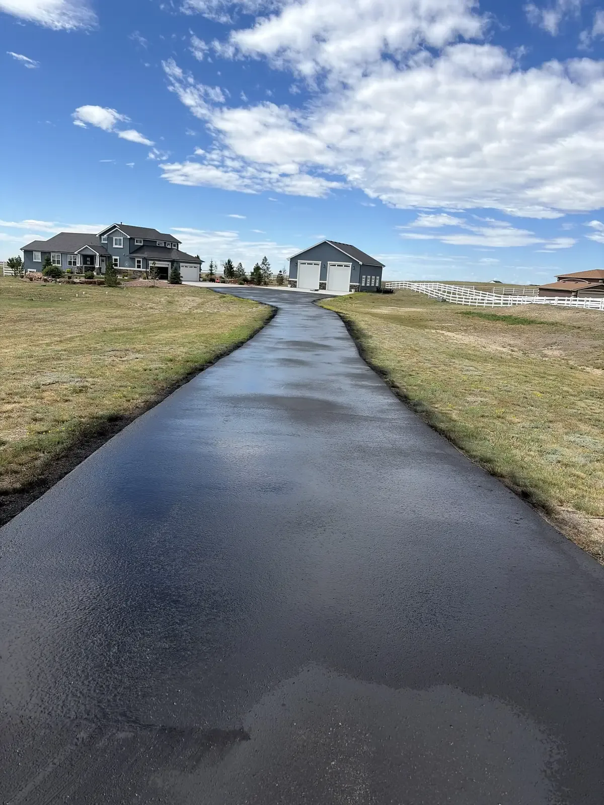 Glossy fresh seal coat on a driveway in Colorado Springs, CO – Olympic City Paving